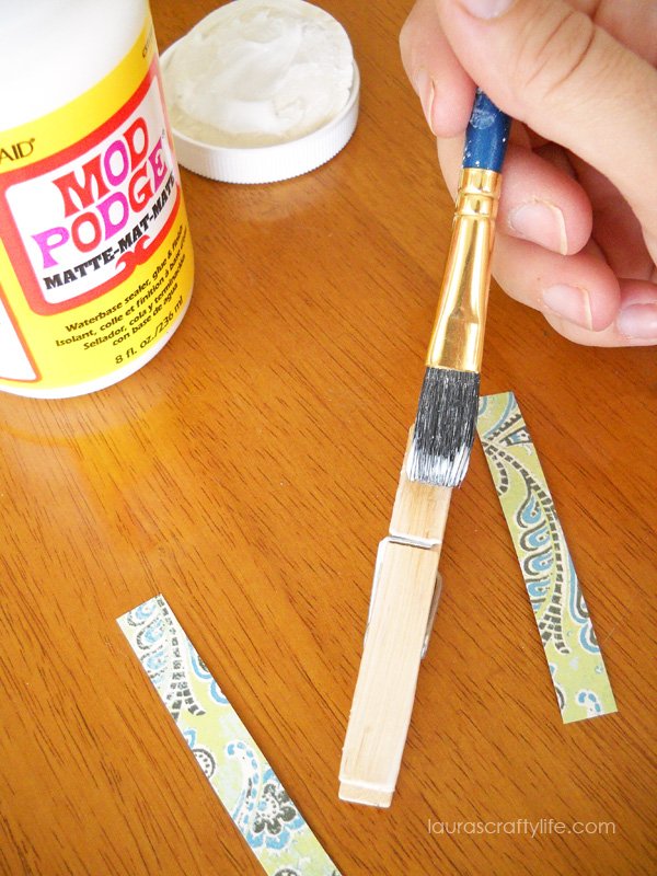 Apply Mod Podge to clothespins