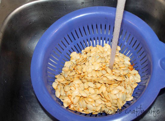rinse pumpkin seeds with water