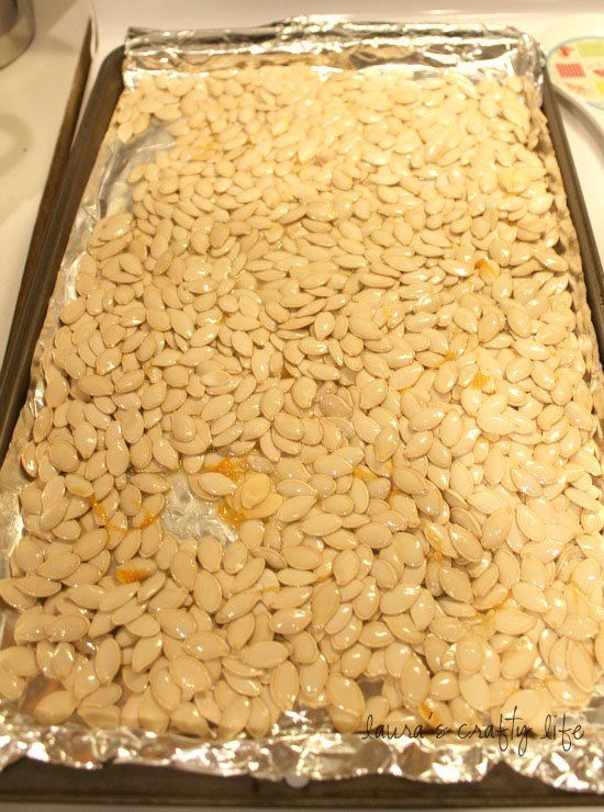 spread pumpkin seeds on pan