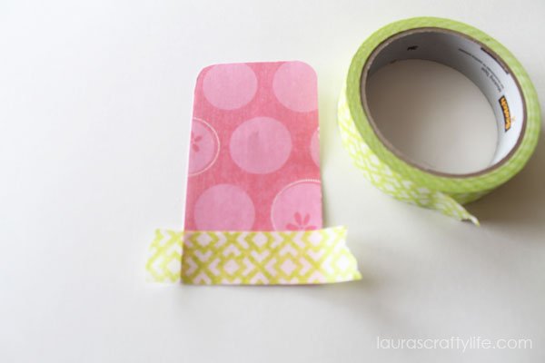 Add Scotch® Brand masking tape to the bottom of patterned paper