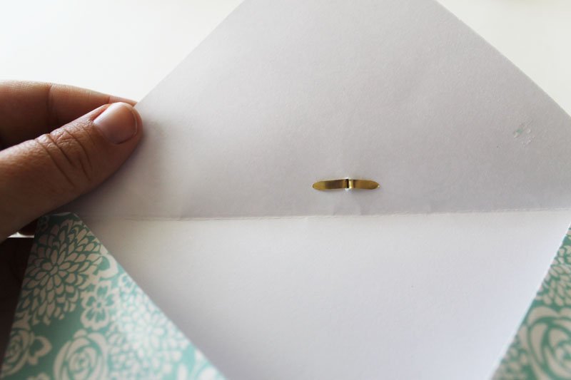 Add brad to inside of envelope