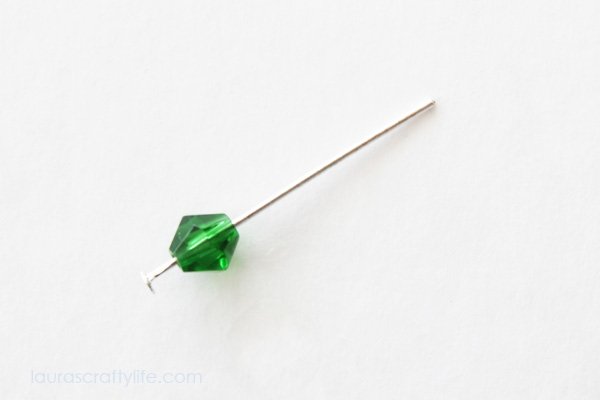 Place bicone bead on head pin