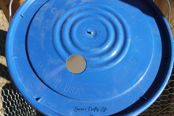Drill hole in top of 5 gallon bucket