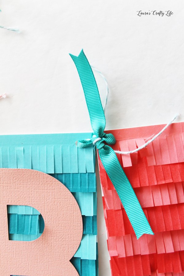 use-ribbon-and-twine-to-tie-the-banner-together
