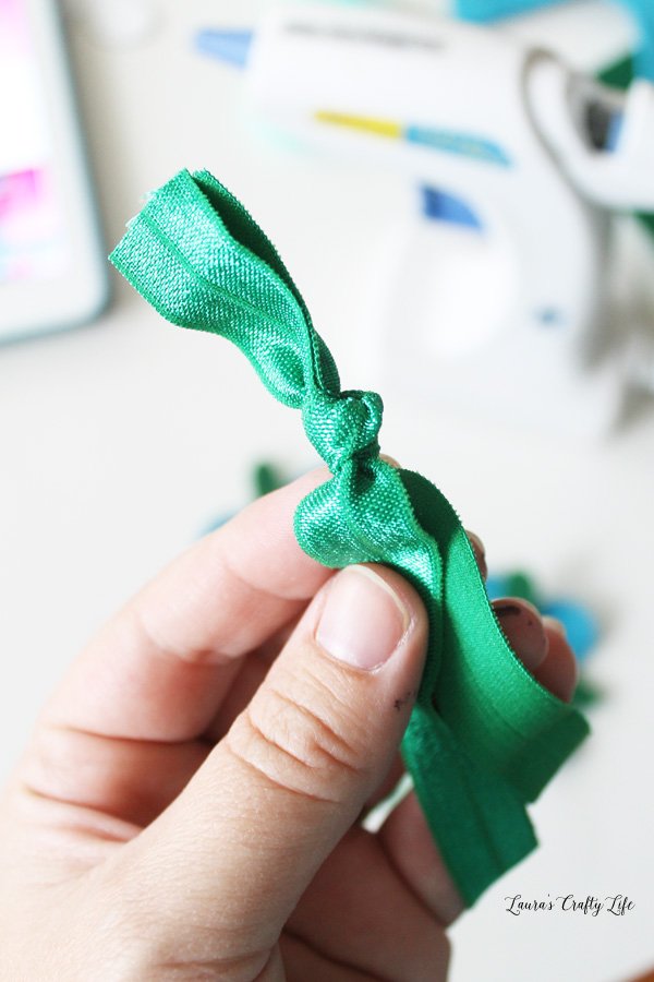 Tie a knot in the elastic