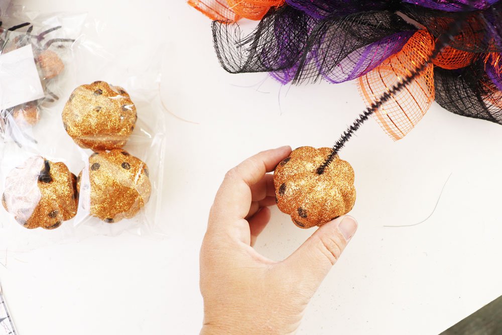poke pipe cleaner into pumpkin